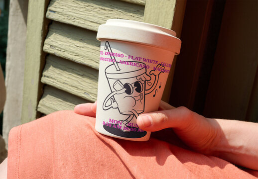Coffee Cup Mockup Held by woman. PSD template mockup.