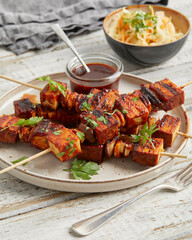 Tofu skewers with sauce and coleslaw