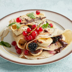 Sweet and savory pancakes on one plate