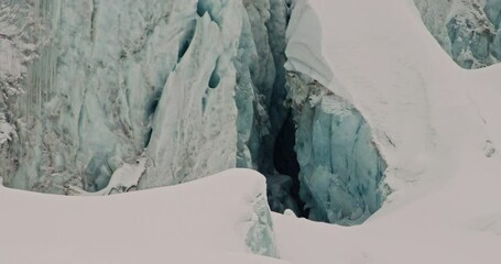 Stunning aerial footage of glaciers in Saas-Fee and Zermatt, showcasing ice formations, crevasses, seracs, and the dramatic impact of global warming on these majestic alpine landscapes. - Powered by Adobe