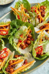 Chickpeas in lettuce leaf with yogurt