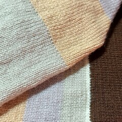 Handmade texture background. Brown and beige wool scart detail - macro shot © NottheHamelin