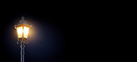 Street lamp shining in the dark. Light from an old lantern at night.