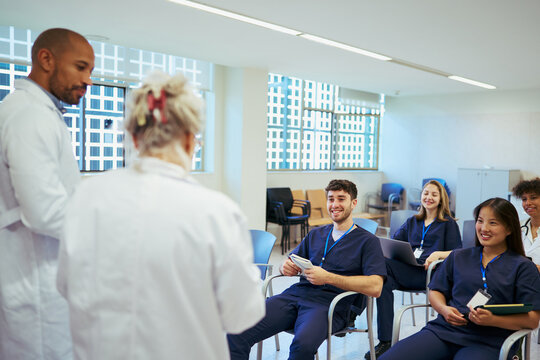 Medical team discussing patient care during hospital meeting