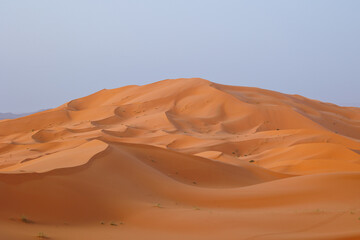 Sunrise panoramic landscape views of Erg Chebbi sand dunes located in Morocco on the western edge of the Sahara Desert