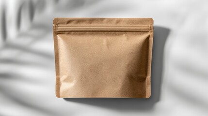 Obraz premium Brown kraft paper pouch mock up with zipper closure, placed on soft gradient background, showcasing minimalistic design and versatility for packaging solutions in various commercial applications