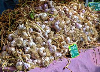 A pile of fresh garlic on a street vendor's table in Toulouse, France
