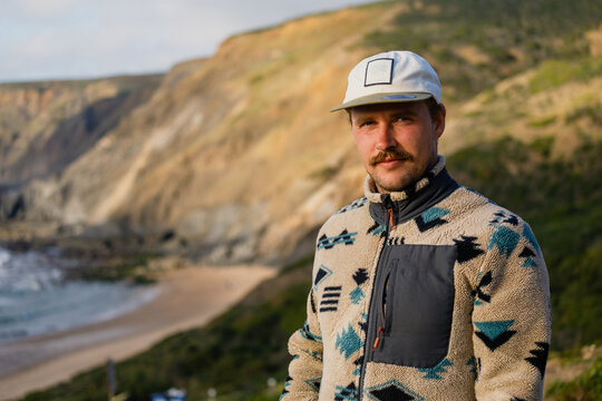 Surfer enjoying stunning coastal view in sagres, portugal