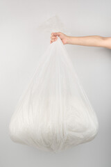 Hand Holding a Full Trash Bag – Waste Disposal Concept