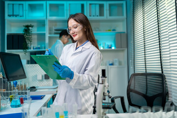 Asian female scientist working in the biotechnology research laboratory. 