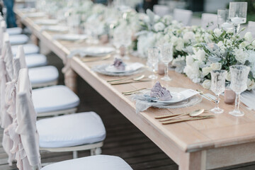 lovely Table setting for magnificent composition from flowers at a wedding , Centerpiece white and orange color palette flower bouquet arrangement