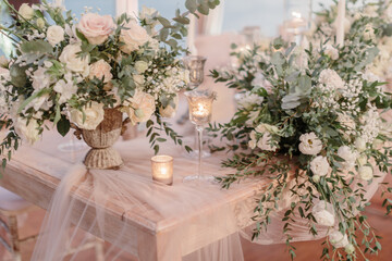 lovely Table setting for magnificent composition from flowers at a wedding , Centerpiece white and orange color palette flower bouquet arrangement