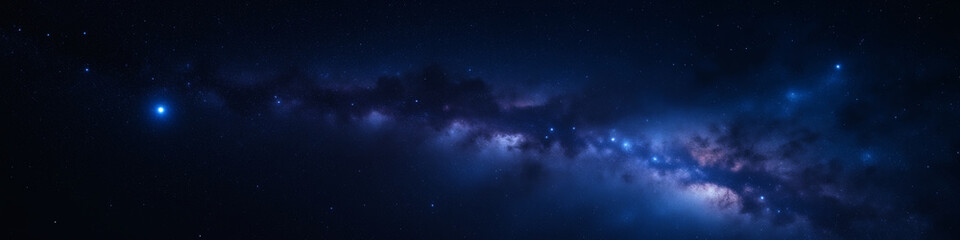 Panoramic view of the Milky Way galaxy on a dark blue night sky, showcasing the vastness and beauty of space with a focus on astronomy and cosmic phenomena for science.