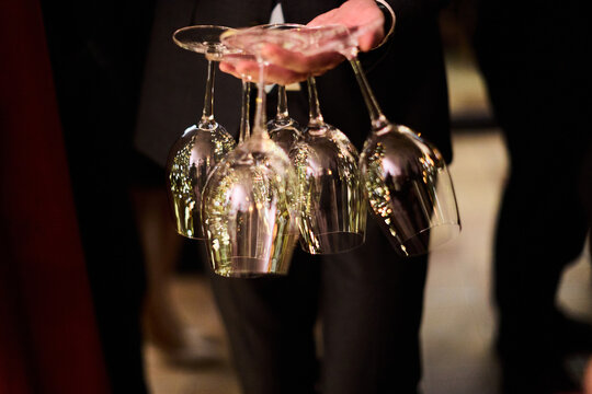Waiter Holding Wine Glasses at Event