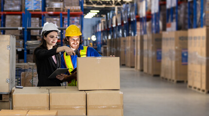 women in professional attire and man in safety gear collaborate on inventory tasks, scanning...