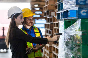 women in professional attire and man in safety gear collaborate on inventory tasks, scanning...