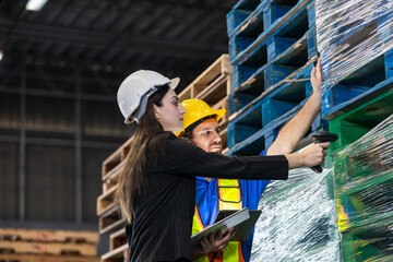 women in professional attire and man in safety gear collaborate on inventory tasks, scanning...