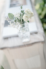 lovely Table setting for magnificent composition from flowers at a wedding , Centerpiece white and orange color palette flower bouquet arrangement