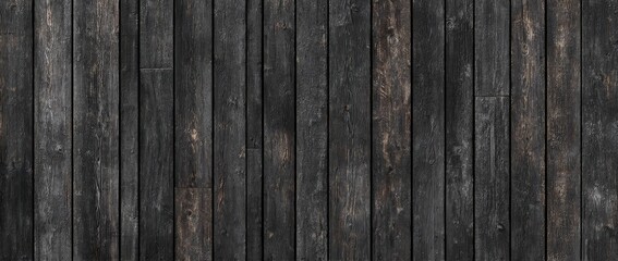 Obraz premium Dark, vertically-oriented wooden planks, showing age and texture variations in shades of black and brown