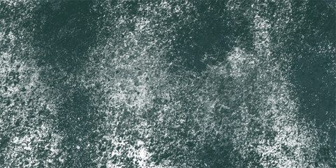 Abstract splattered white and gray grunge texture with dense speckles, smudges, and rough paint splatter effect background. Weathered look reminiscent of concrete walls or snowy patterns. 