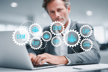 Businessman accesses CRM and ERP symbols to support business database analysis.