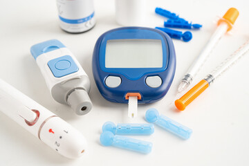 Glucometer lancet and test stick measuring human blood sugar level for diabetes.