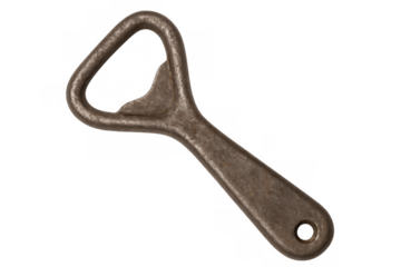 Rustic metal bottle opener resting against clear surface, capable of swiftly uncapping beer, soda, and other refreshing drinks