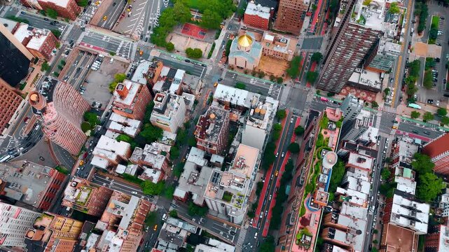 Flying over the variegated urban landscape of modern vibrant city. Lively streets of New York, USA from drone.