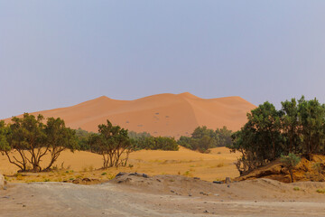 Erg Chebbi sand dunes viewed from Merzouga desert town  located in Morocco on the western edge of...