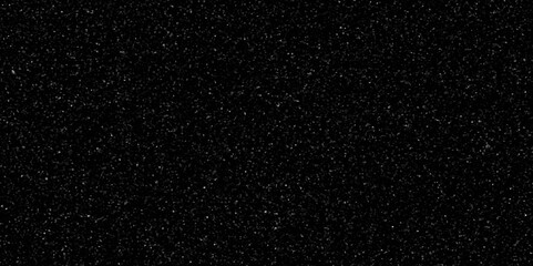 Terrazzo black background with scattered gray and white dots. Rock spatter stone marble backdrop. Black wall texture with noise overlay pattern. Vintage quartz terrazzo flooring.	