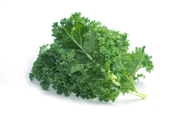 Fototapeta premium Organic fresh Kale Green cabbage (Brassica oleracea var. sabellica) - Kale green leaf isolated before white background. Kale has the highest vitamin K content of any vegetable.