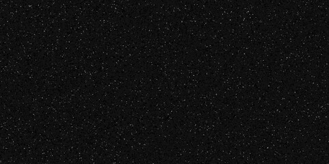 Obraz premium Terrazzo black background with scattered gray and white dots. Rock spatter stone marble backdrop. Black wall texture with noise overlay pattern. Vintage quartz terrazzo flooring. 