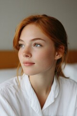 portrait of traveler in minimalist hotel room any race age or gender surrounded by clean decor neutral tones and empty