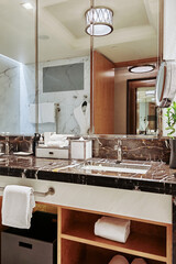 Elegant hotel bathroom with modern amenities and stylish decor in luxury setting