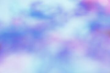 Image features an abstract, colorful blur with shades of pink, purple, and blue, creating a dreamy and soft bokeh effect.