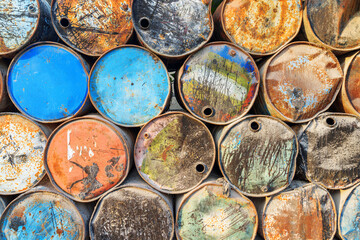 Scenic view of old metal barrels in a port