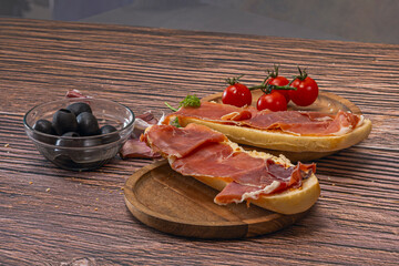 Slices of Serrano Ham with Olives or Cheese:
