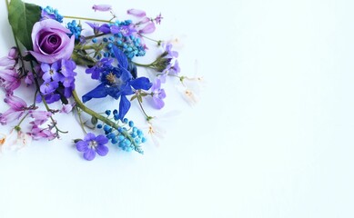 A summer bouquet with roses in lilac tones.  A flower arrangement with a place for text.