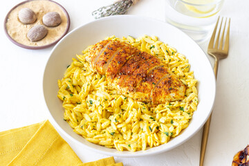 Orzo pasta with roasted chicken breast and curry sauce. Recipe. Healthy eating.