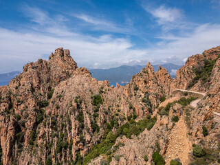 The D81 road winds its way through the Calanches de Piana on the west coast of the Mediterranean island of Corsica