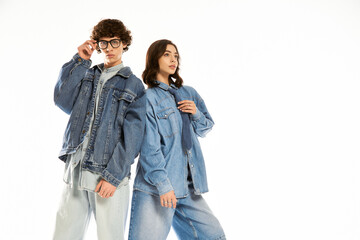 Stylish young couple expressing love and fashion in a bright studio setting