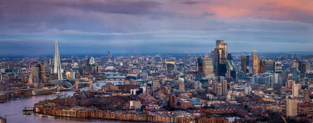 Wide panorama of the urban London city skyline during a colorful sunrise, United Kingdom