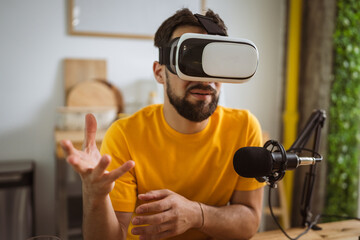 man wear virtual goggles while record podcast at home studio