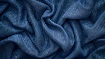 Denim fabric texture in classic indigo blue with visible stitching and grain.