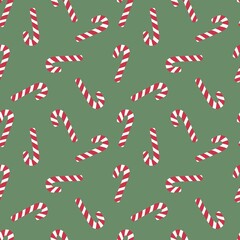 Festive candy cane pattern with red and white stripes on green background, perfect for Christmas wrapping paper, textiles, greeting cards, and holiday-themed designs.