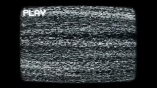 Old VHS tape playback simulation with classic analog TV distortion, glitch flicker, and &ldquo;PLAY&rdquo; text overlay. Vintage screen noise and scanlines add authentic retro vibes. Ideal for nostalgic edits, mu