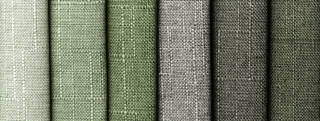 Woven fabric swatches in green and gray shades with coarse texture for upholstery and interior...
