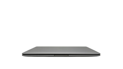 Sleek silver laptop closed on black background depicting technology and digital workspace concept