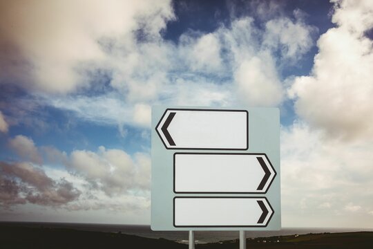 Fototapeta Digital composite of blank sign post