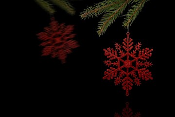 Two red glitter snowflake ornaments are hanging from pine branch in vector on black backdrop